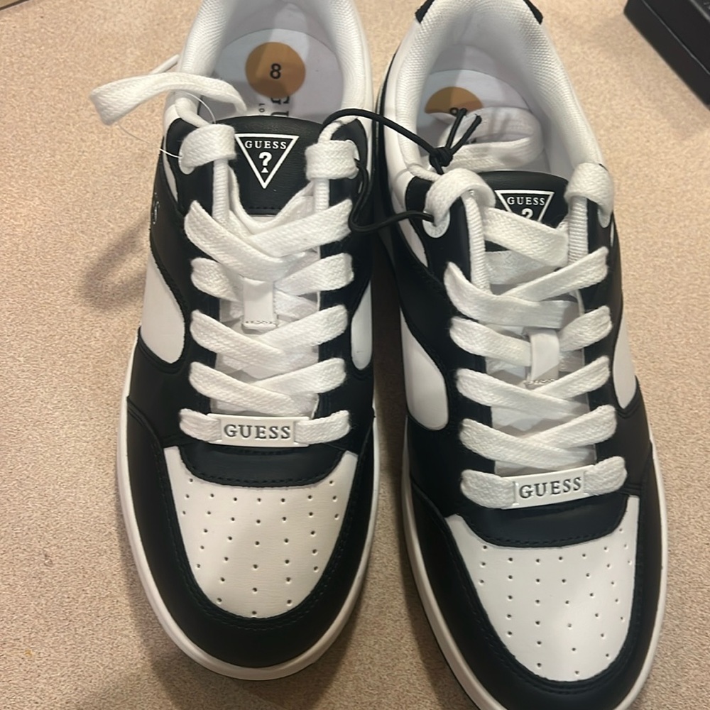 Women’s guest sneakers never worn. New with tag non-smoking home.